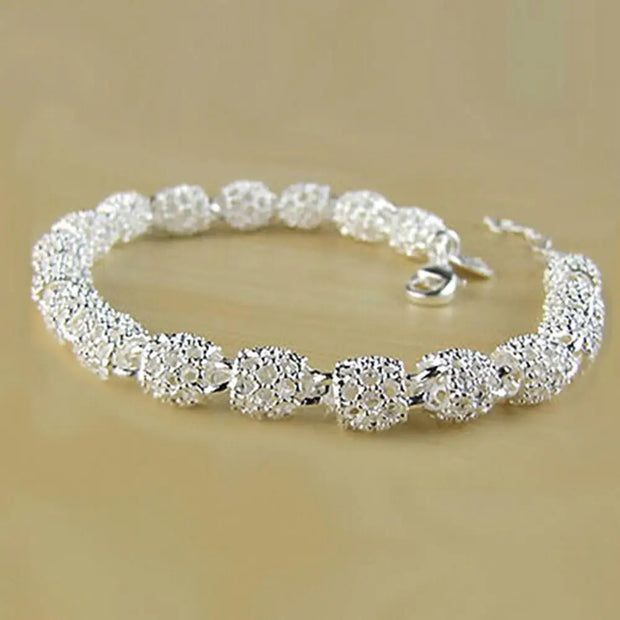 Elegant Silver-Plated Hollow Ball Bracelet Side View
